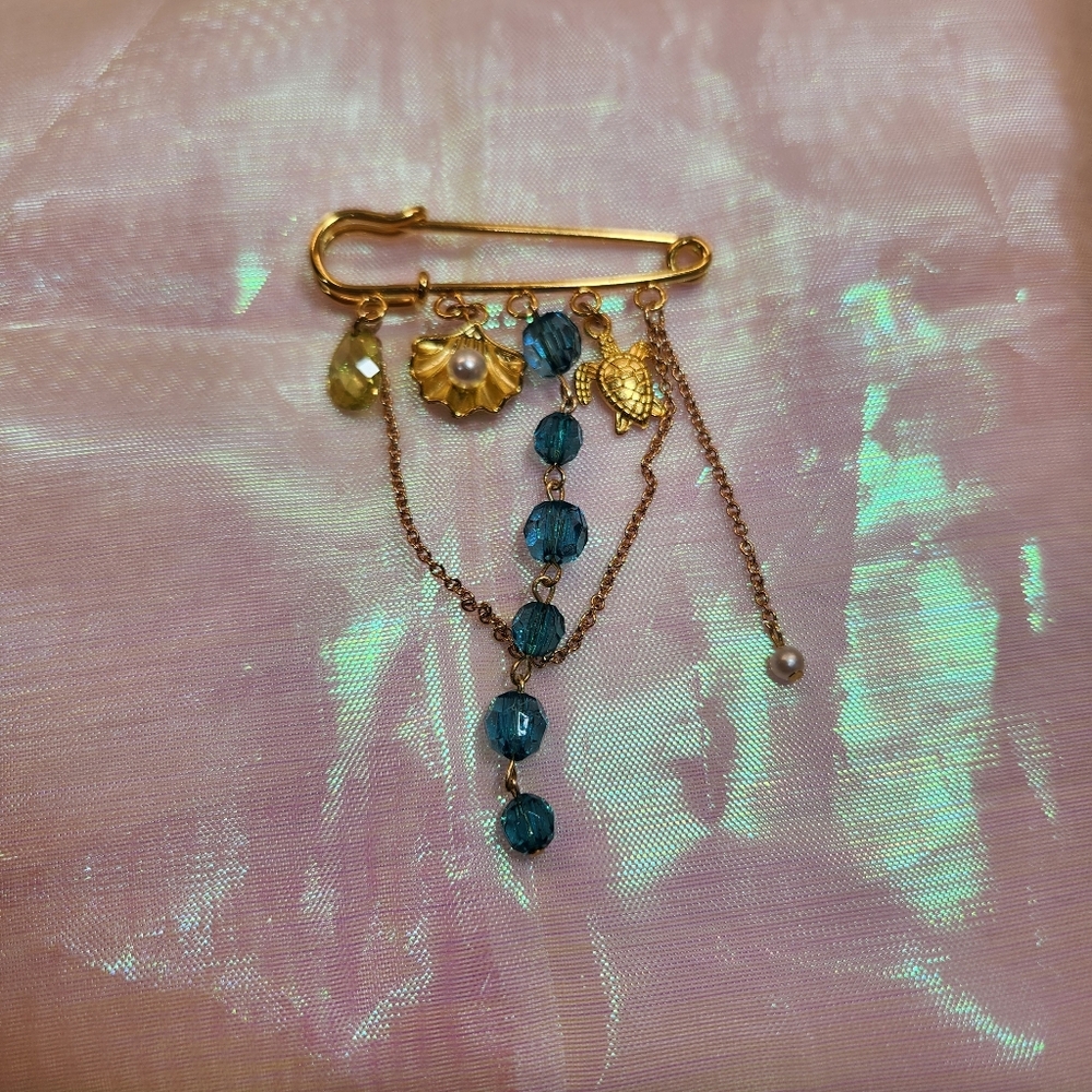 Gold Toned And Blue Beaded Ocean Brooch
